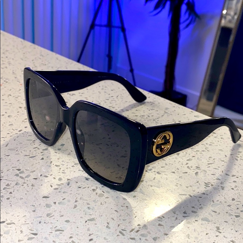 Black and gold medium sized Gucci sunglasses